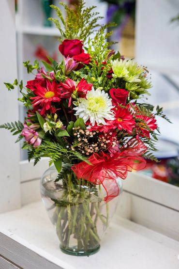 beautiful red floral arrangement at Sarah's Sweets & Flower Shoppe