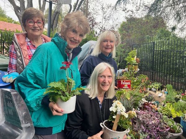 A few of our members with plants that were created to sell at our plant sale.