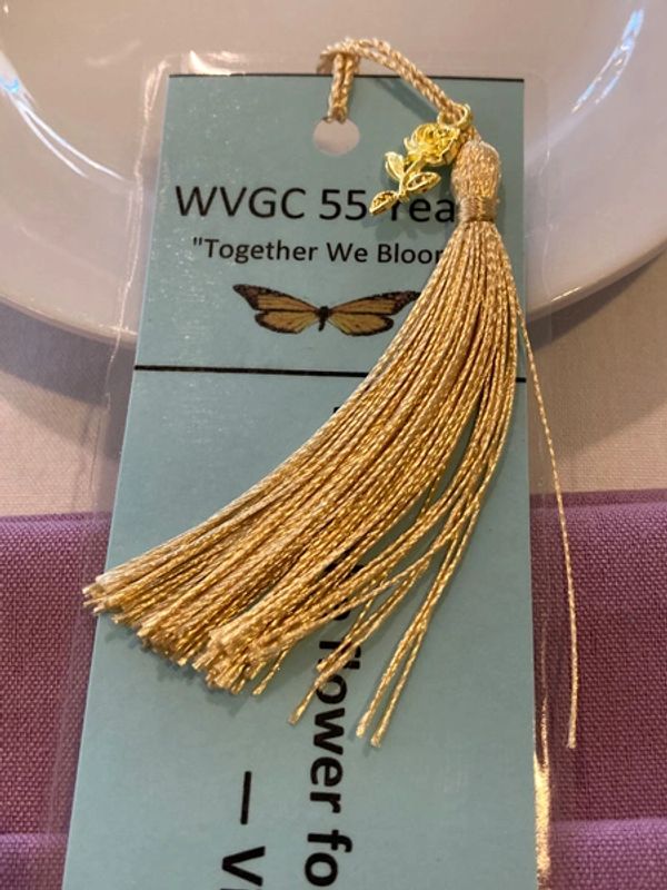 Each attendee received a commemorative bookmark placed with their table setting.