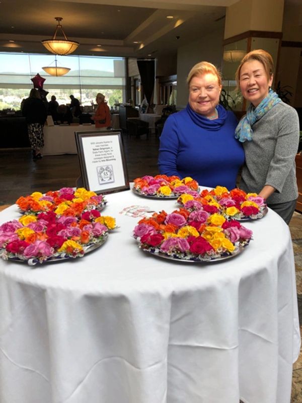 Garden club members in front of the corsage table.