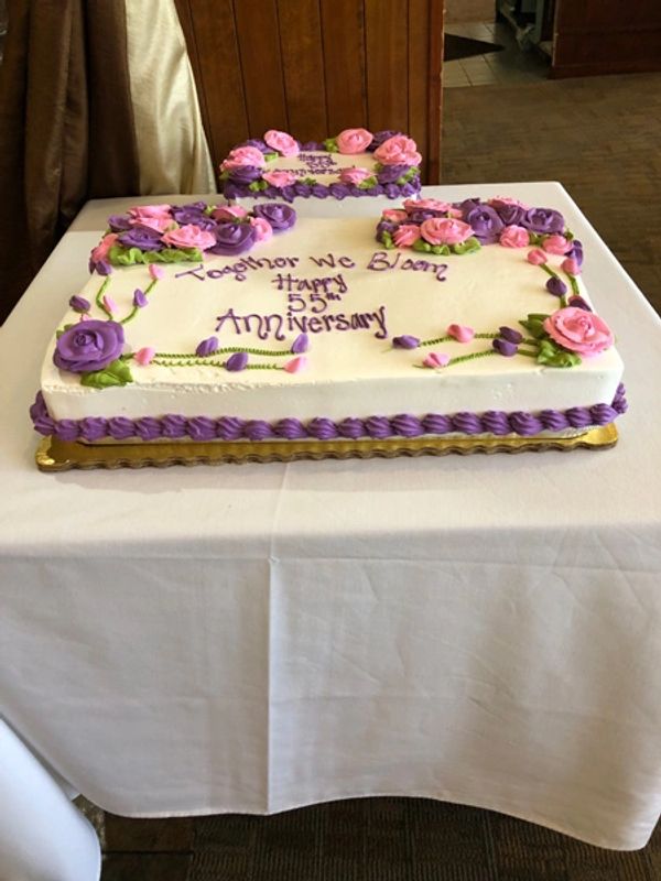 Anniversary cake on presentation table.