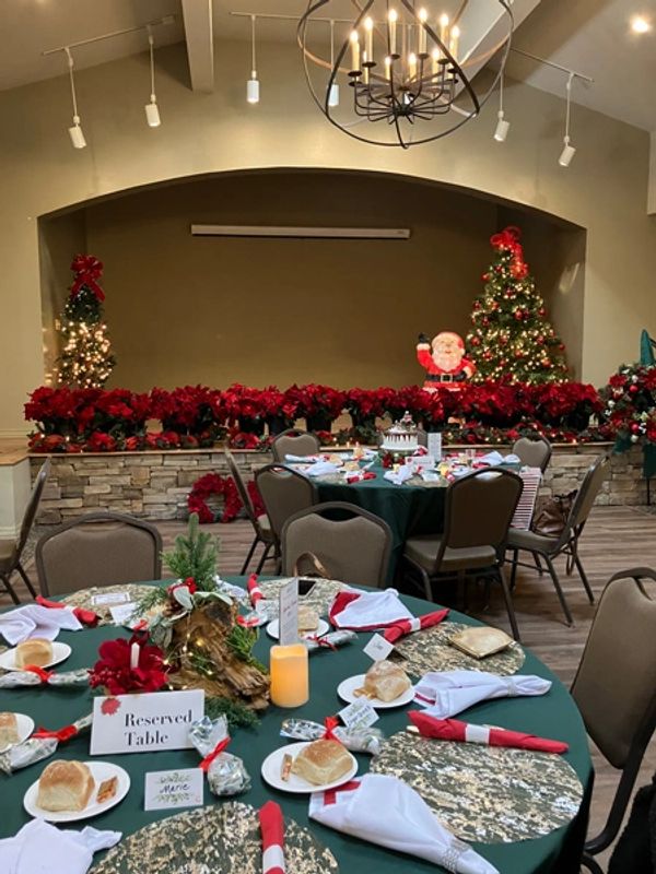 Closeup of the tables with place mats and with the first course of the luncheon.