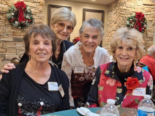 Four garden club members attending the 2024 Holiday Luncheon.