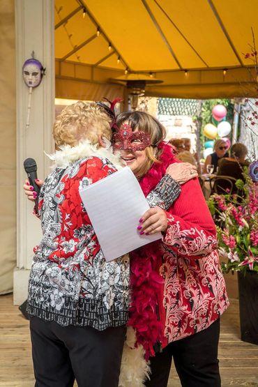Two WVGC members hugging.