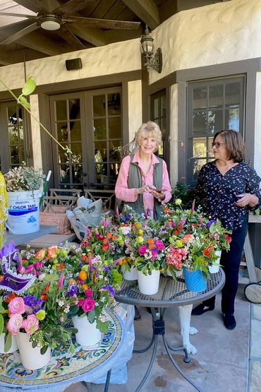 Two members viewing table decorations.