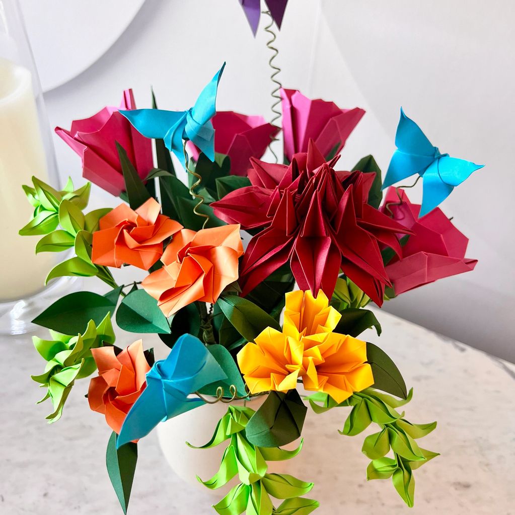 bouquet of bright and colorful origami flowers with origami butterflies