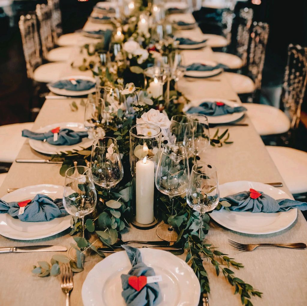 red origami hearts with guests names as place holders in a beautiful wedding reception dinner settin