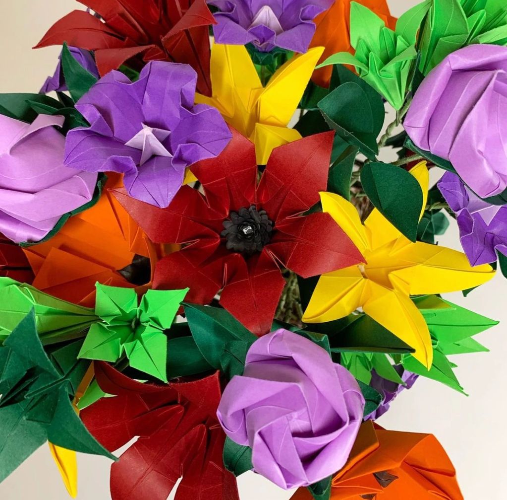 colorful origami bouquet in vivid red orange yellow lilac purple green and lime green paper