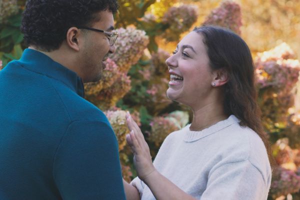 Couple happily interacting outdoors.