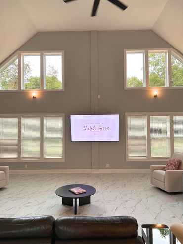Modern senior living room with TV and comfortable seating.