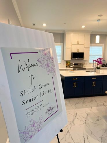 Welcome sign for Shiloh Grove Senior Living in a modern kitchen setting.