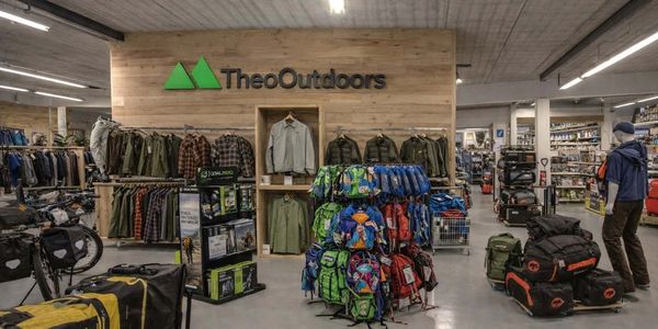 Outdoor gear and clothing displayed in a TheoOutdoors store.