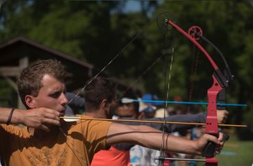 a group participates in an archery experience in the hocking hills