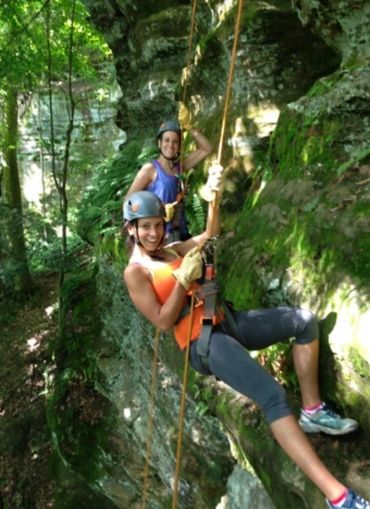 women rappelling on their adventure in the hocking hills