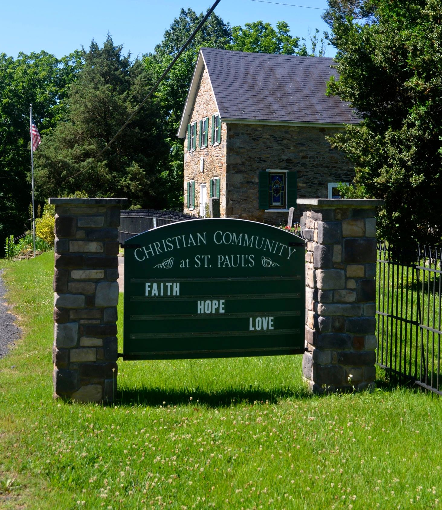 Faith, Hope, and Love sign  in front of the Christian Community Church at St. Paul's.