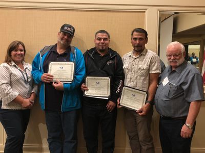 Instructor Larry Olsen with members who completed course in 2017-2018 year with Chairperson D. McKay