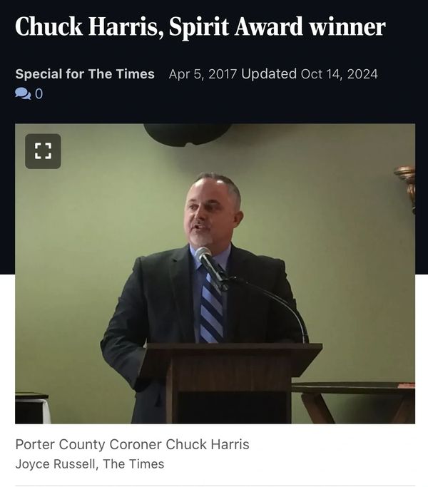 Chuck Harris speaking at an award event.