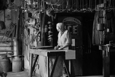 Grandpa working in his fur trading taxidermy shop