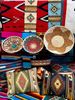 Handwoven rugs and colorful ceramics showcasing Southwest patterns at Native Gardens of Green Valley