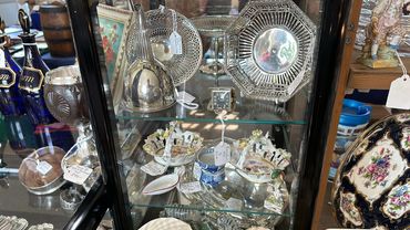 Cabinet of solid silver and porcelain items