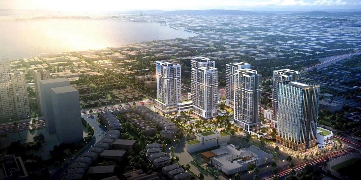 Khu đô thị hiện đại với các tòa nhà cao tầng sáng đèn.