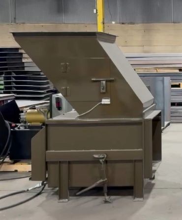 Stationary compactor being tested at the Elite Containers factory, Waterbury CT