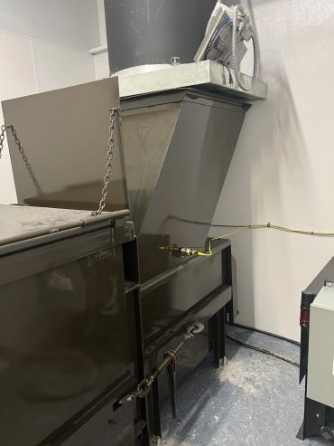 Stationary compactor installed under a chute hopper, Elite Containers, Waterbury CT