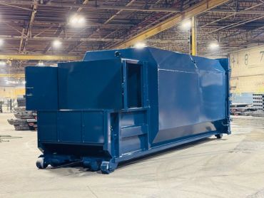 Blue self-contained compactor, three-quarter view, Elite Containers, Waterbury CT