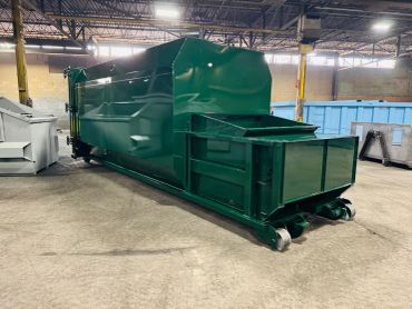 Green self-contained compactor, rear view, Elite Containers, Waterbury CT