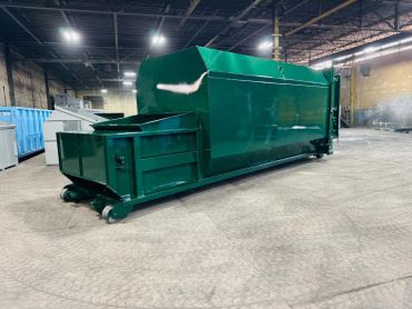 Green self-contained compactor ready for delivery, Elite Containers, Waterbury CT