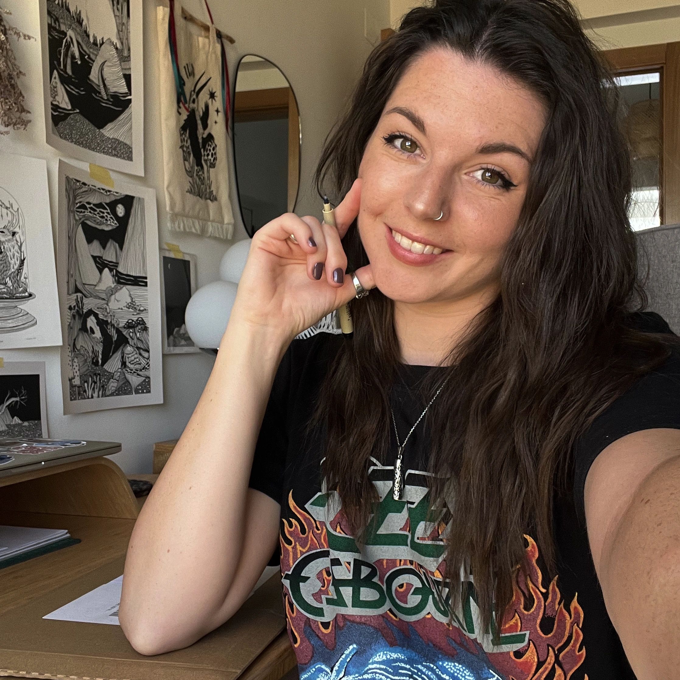 Smiling woman in a casual artistic room.