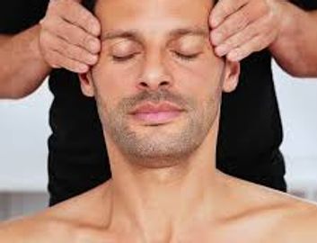 A man receiving an Indian Head Massage