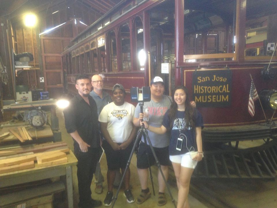 A group of five people posing inside the San Jose Historical Museum.