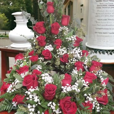 Red rose urn tribute flower arrangement