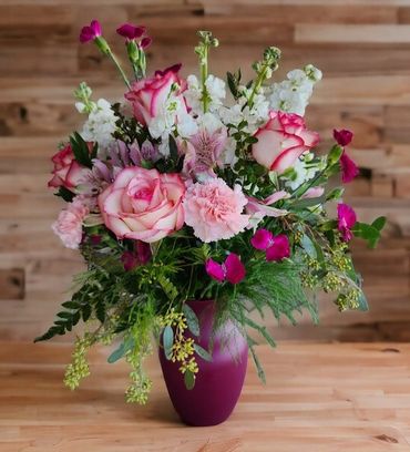 Pink roses, carnations and snapdragon vase arrangement