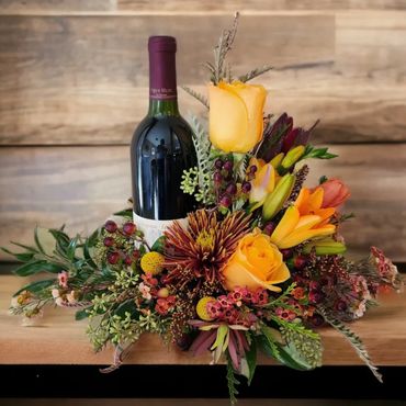 Wine Bottle Flower Arrangement with Orange Lilies and Yellow Roses