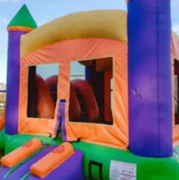 children bouncing in a bounce house castle