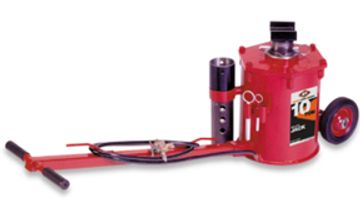 Red hydraulic bottle jack with handle and wheels.