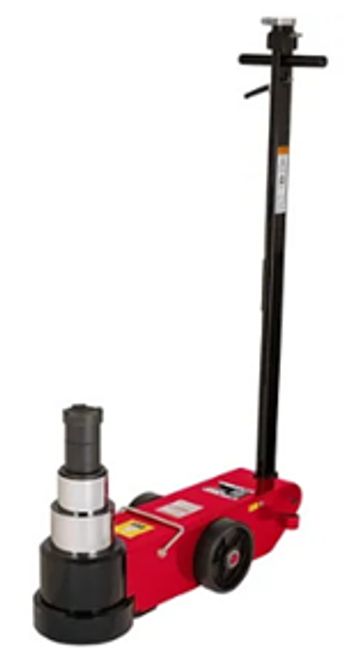 Red hydraulic jack with handle and wheels.