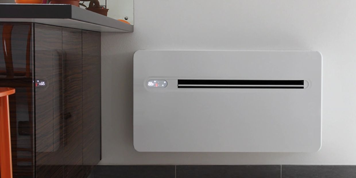 Modern white wall-mounted heater with digital controls.