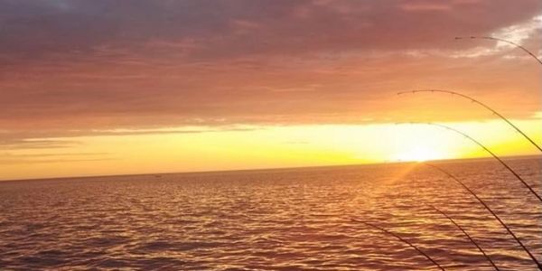 Beautiful Sunrise on Lake Michigan aboard a morning fishing charter in Washington WI. 