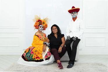 Maria Jose catrina makeup artist with models wearing Oaxaca traditional attire.