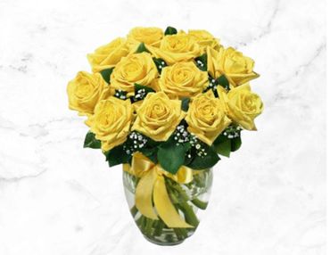 A bouquet of vibrant yellow roses in a glass vase with a matching yellow ribbon.
