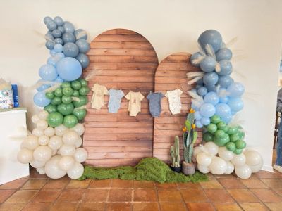 blue green cream balloons with wood background Affordable Baby Shower Venue in DFW