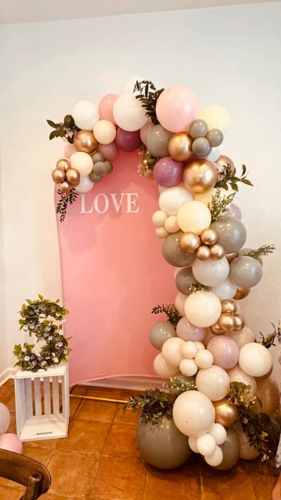 Custom pink gold and rose gold balloon decor at events on 26