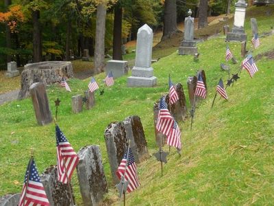 Flags decoration a row of veterans graves at Lakewood Cemetery Cooperstown