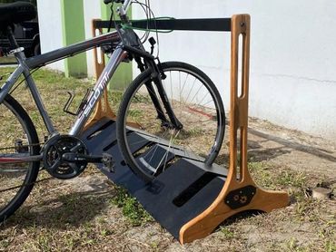 Wood and acrylic bike rack, volunteer project, CNC machined with laser-cut side panels. 2023