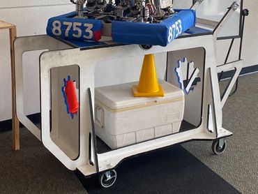 FRC Robot Cart, designed in Fusion 360, with storage, team logo, and drive controller rack. 2023