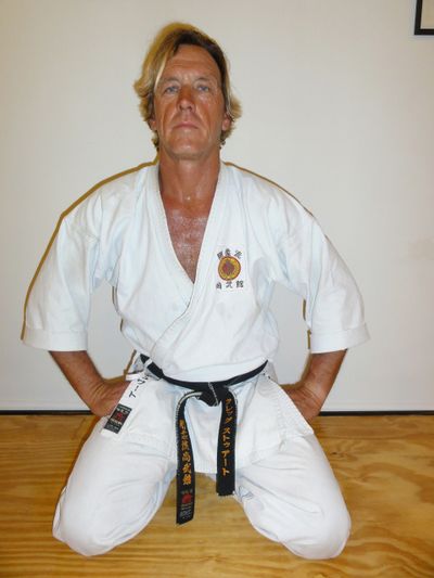 instructor kneeling on the floor