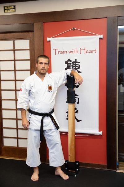 instructor leaning on training equipment
